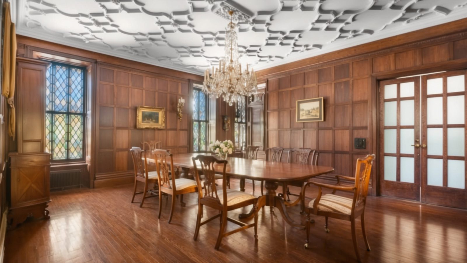 02 a formal dining room with wood paneled walls, an ornate ceili