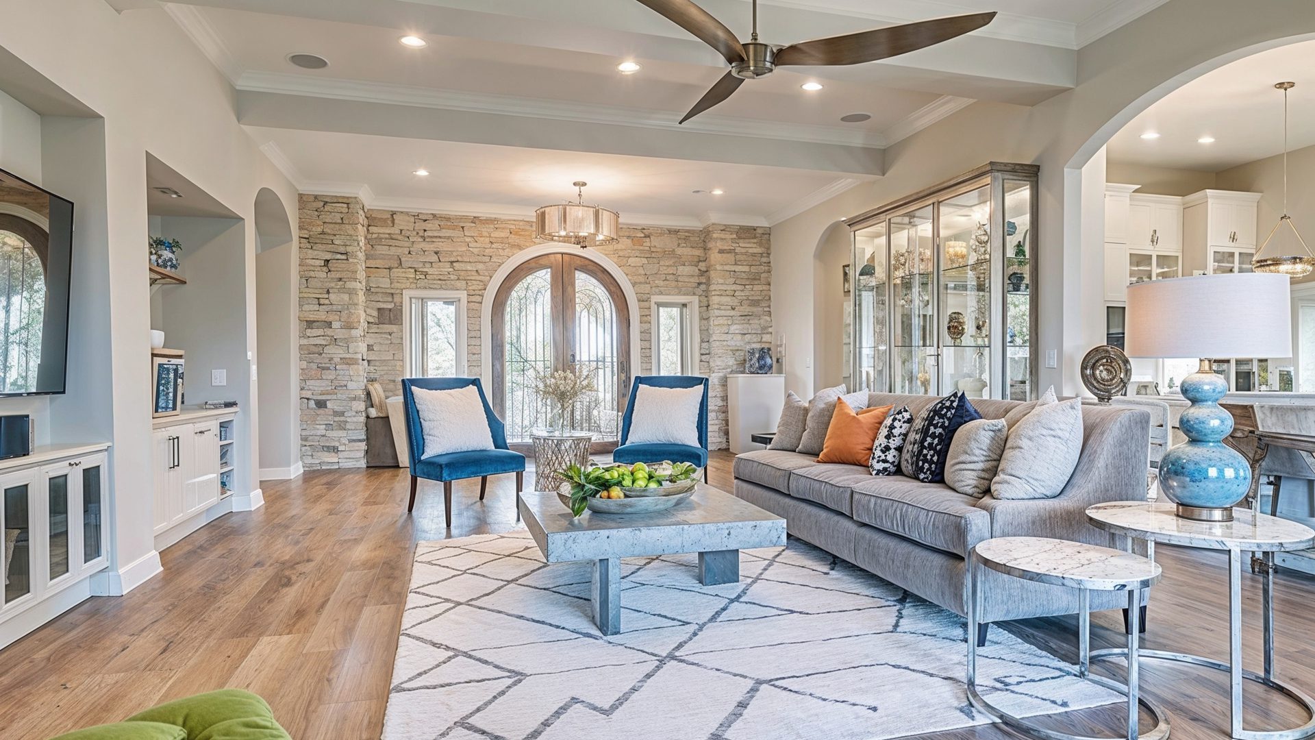 Bright Open Concept Living Room With Stone Accent Wall