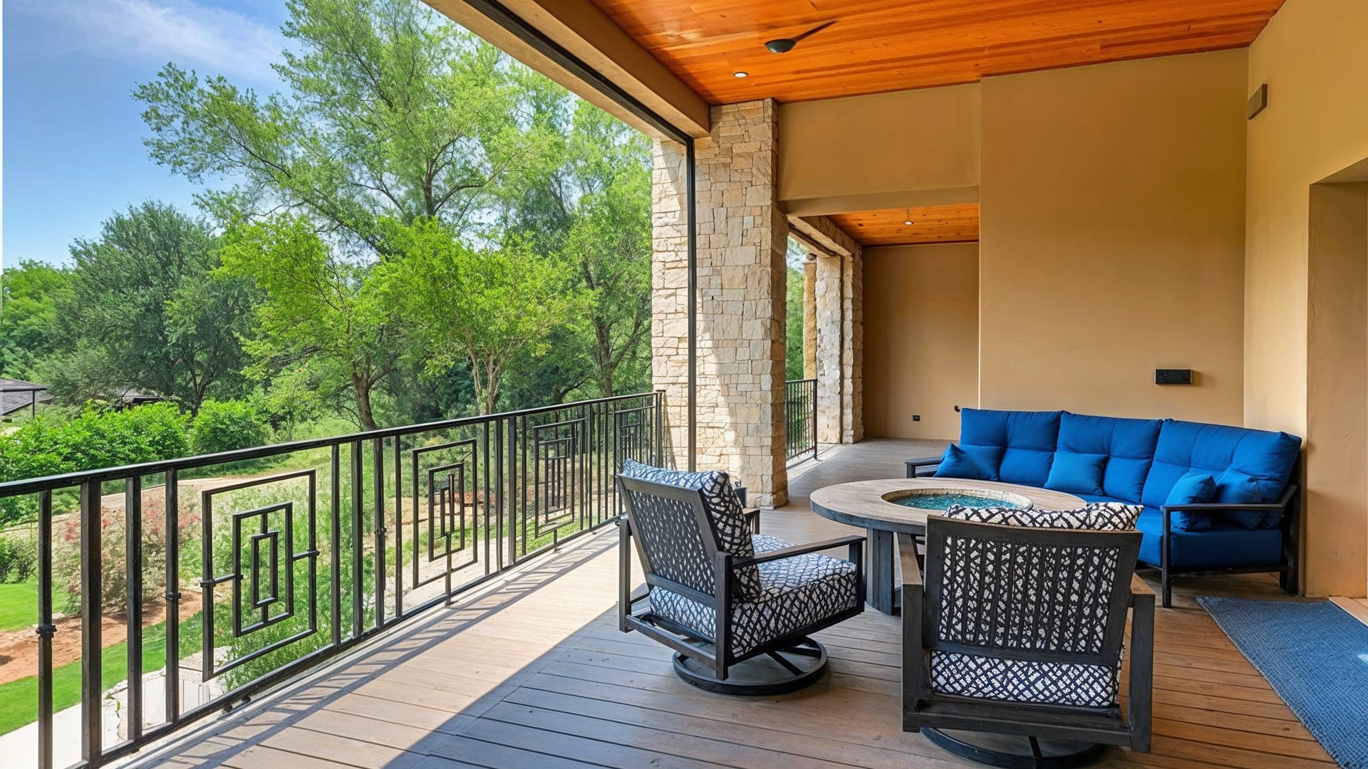 Covered Balcony With Warm Wood Ceiling And Blue Accents