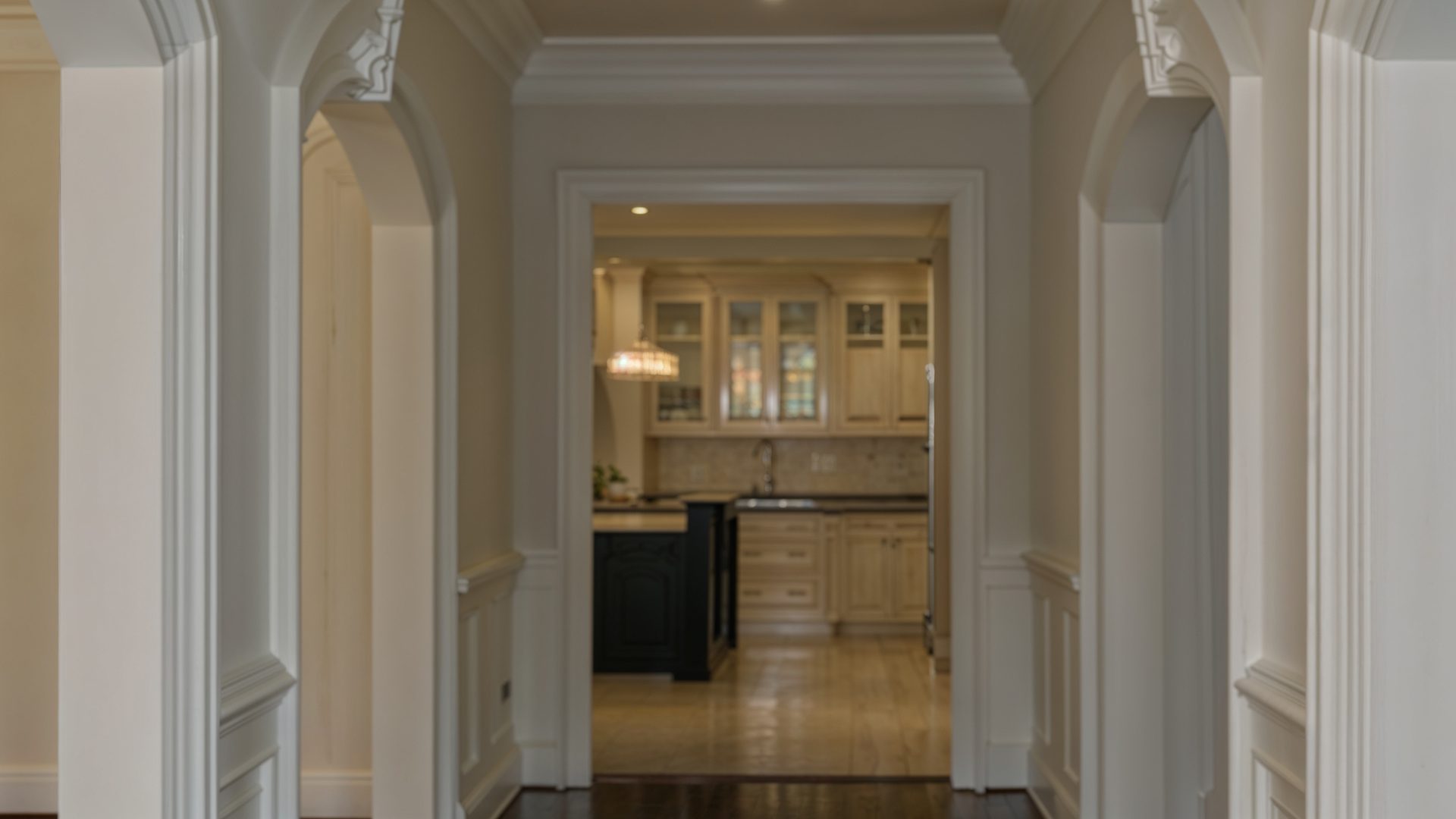 Elegant Arched Hallway Leading to Kitchen – Transitional Space in Ovechkin’s Home