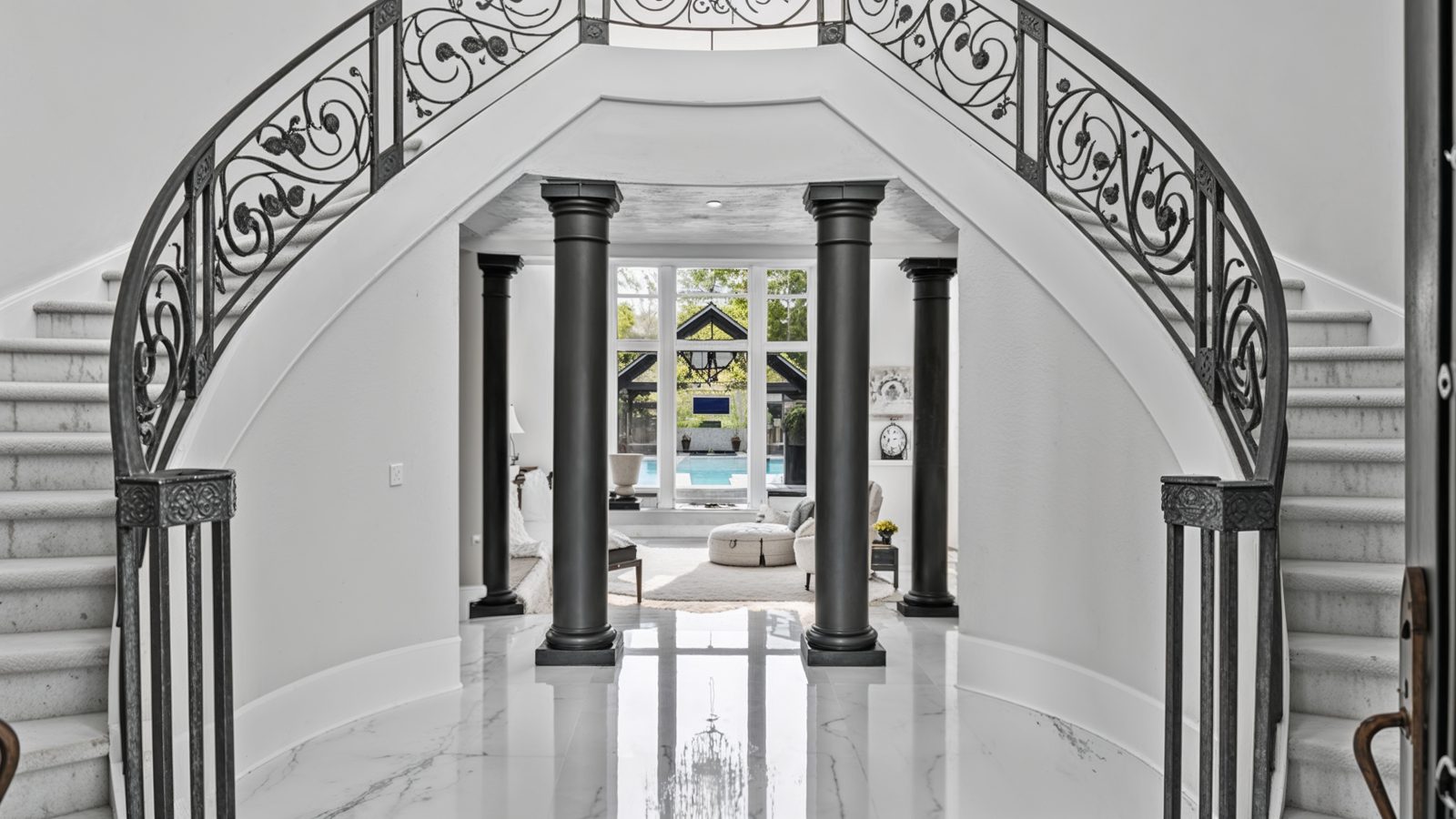 elegant foyer with dual staircases in stenhouse mansion