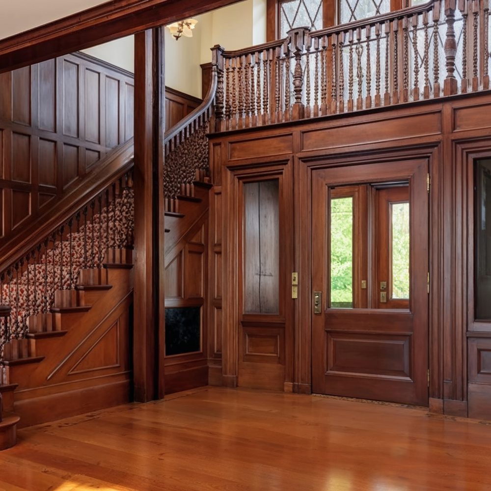 03 elegant oak foyer with dramatic staircase at copper beech far