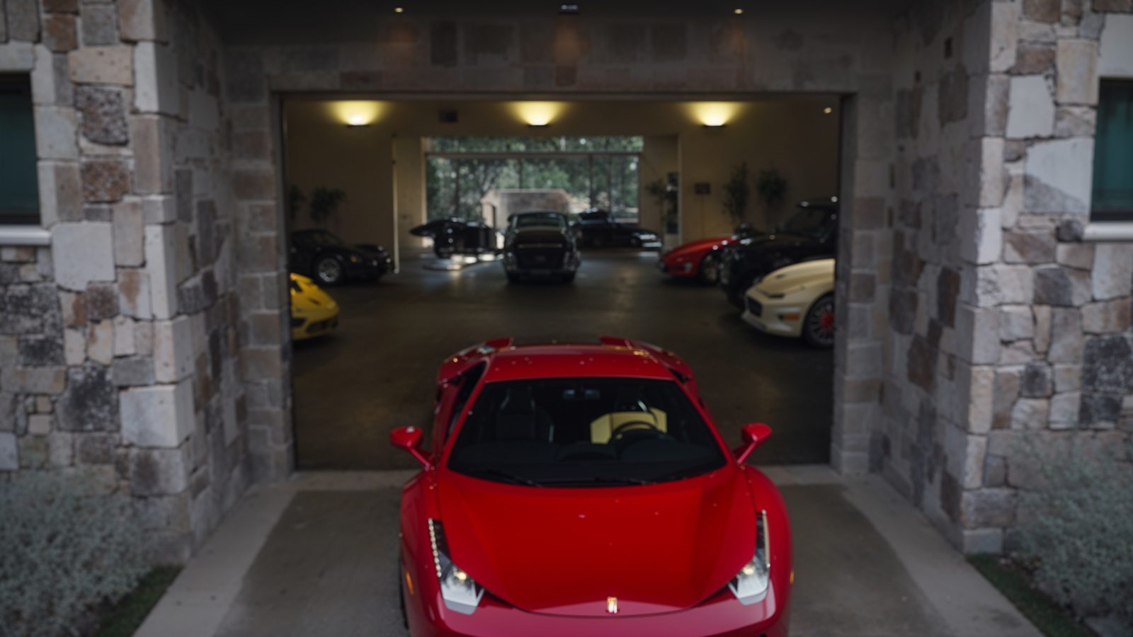 expansive garage with luxury car collection