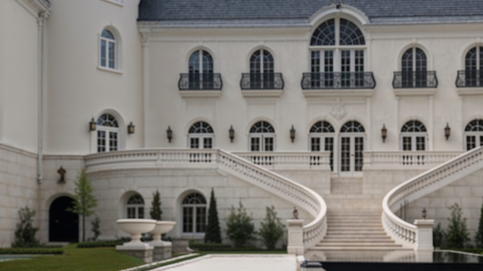grand dual staircase leading to the courtyard
