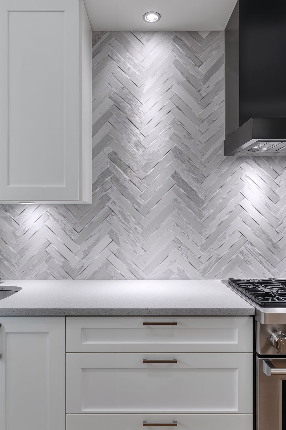 Gray Chevron Tile Backsplash Pattern With White Cabinets