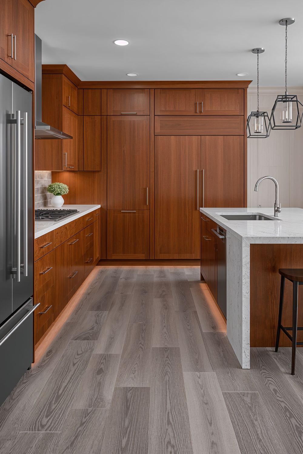 Gray Toned Wood Floors With Cherry Cabinets