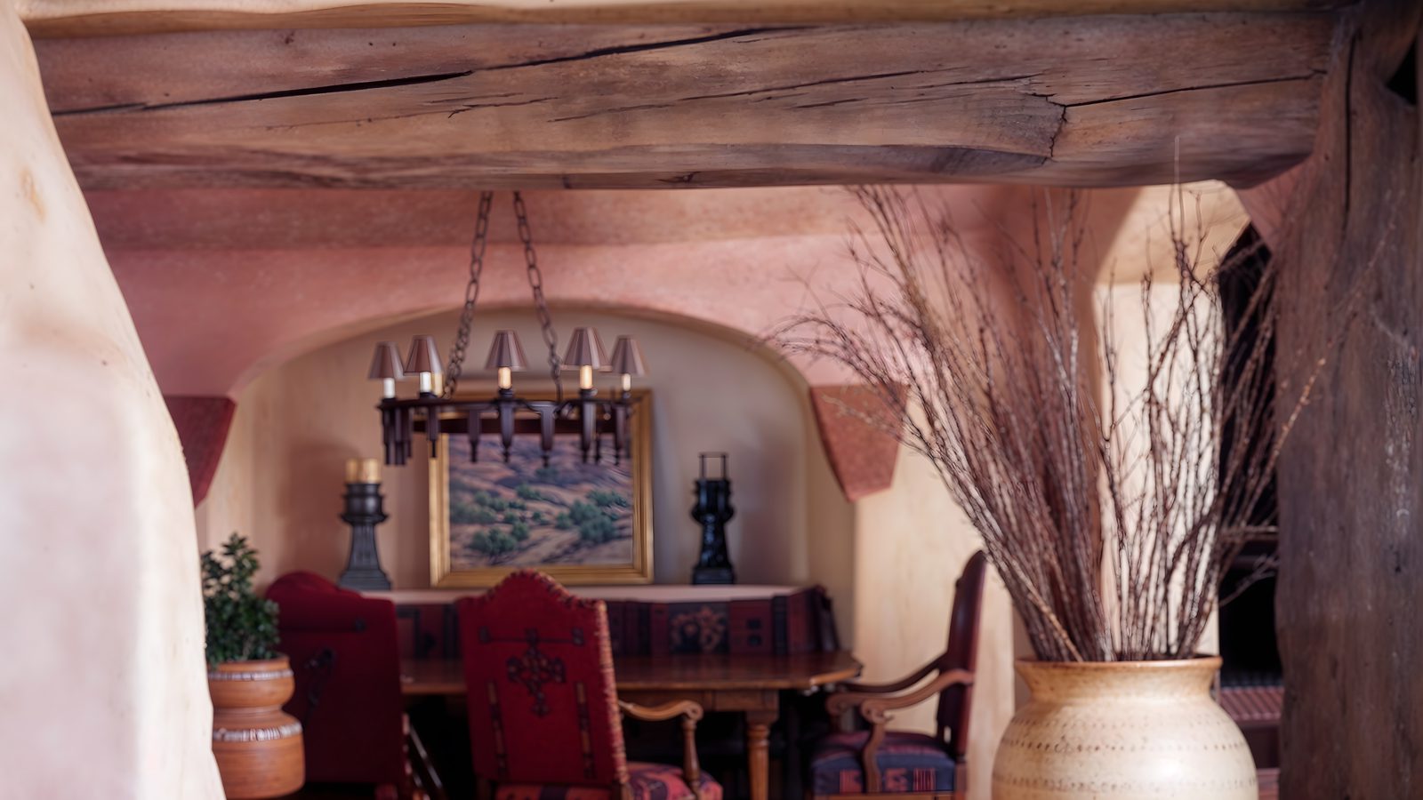 intimate dining nook with adobe archway