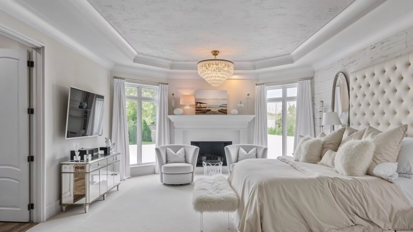 luxurious master bedroom with plush decor
