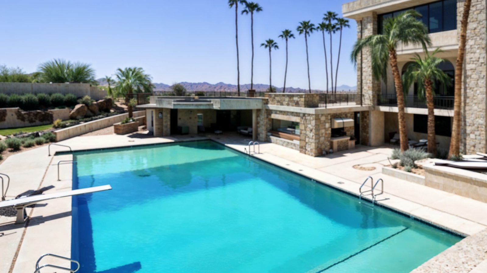 olympic sized pool with palm trees at walker mccune mansion