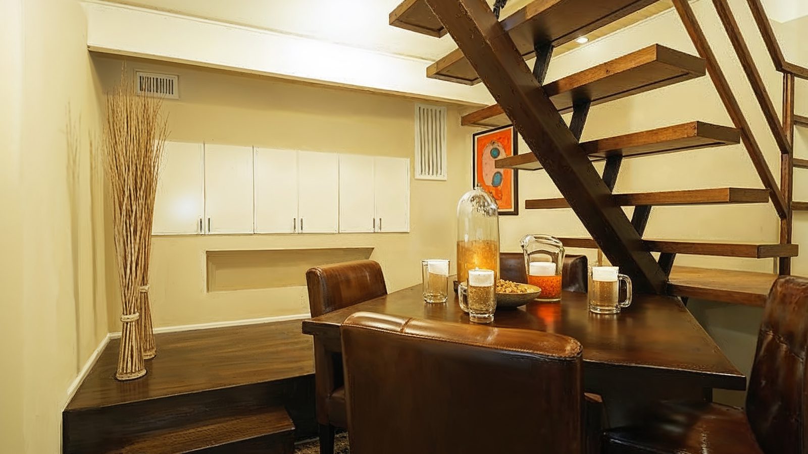 sophisticated lounge area beneath staircase in pamela bach%e2%80