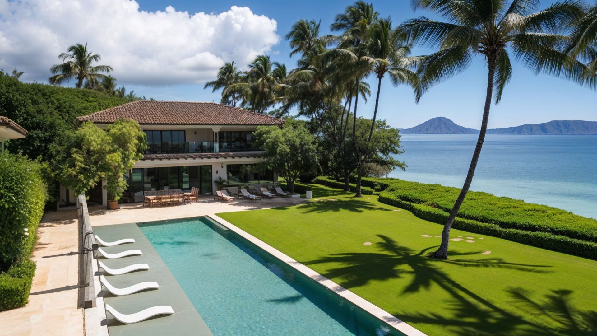 Upper Deck Poolside View With Palm Trees And Lawn Border