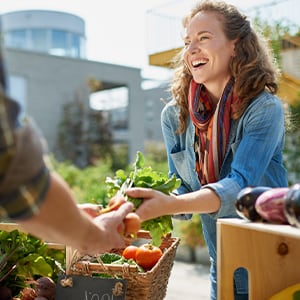 A woman shopping for organic vegetables.