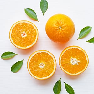 Several oranges, which are high in vitamin c.