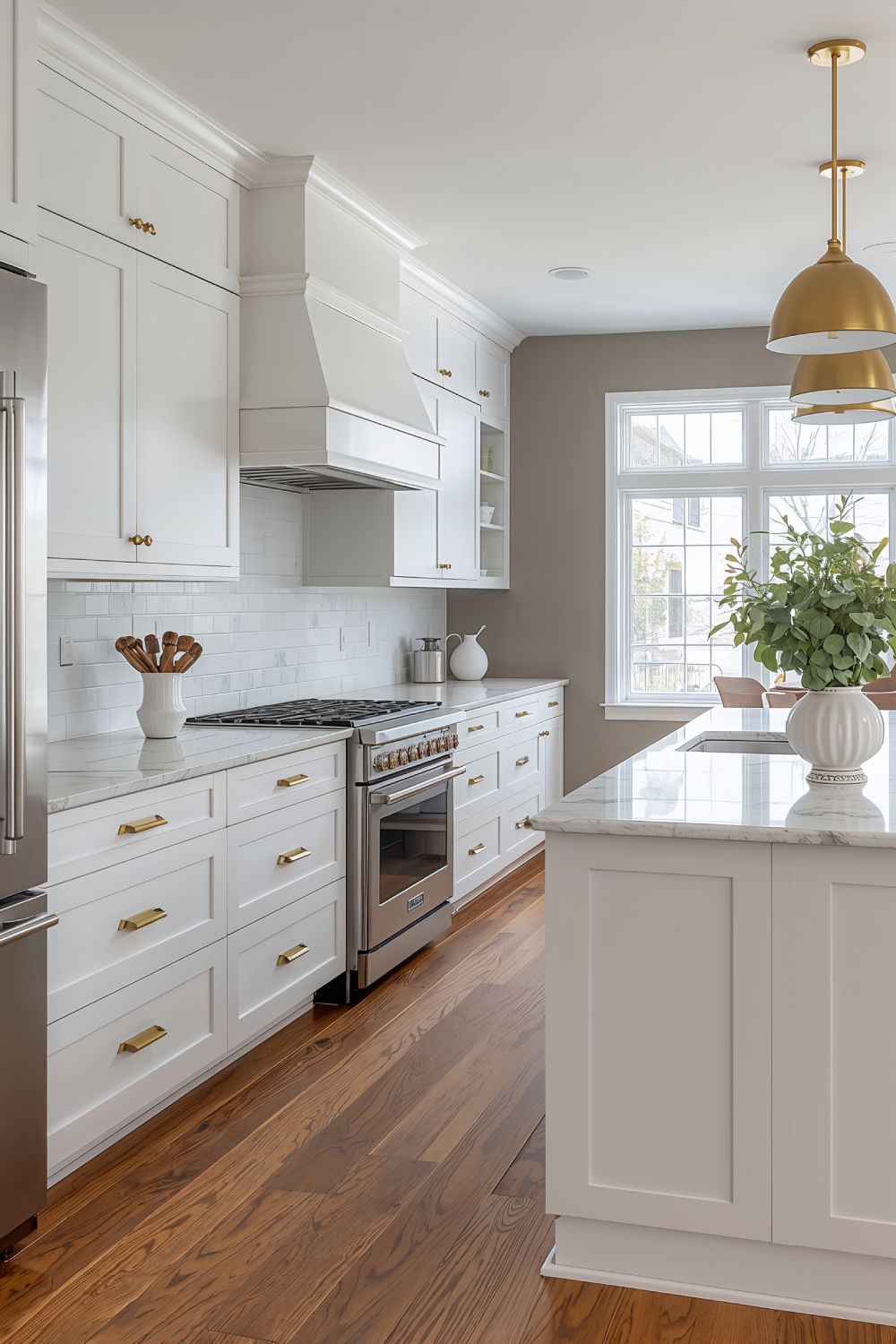 White Cabinets With Brass Hardware On Agreeable Gray Walls